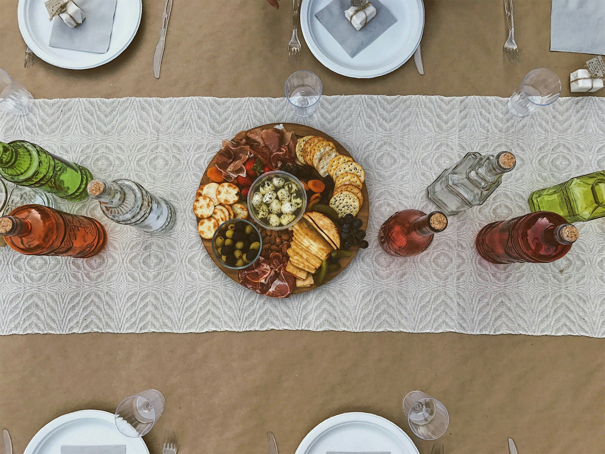 A Georgian supra laid end to end with shared plates, bread and Qvevri wine