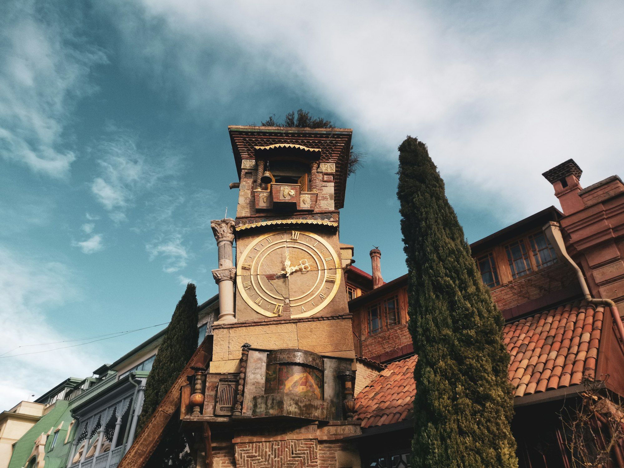 The Rezo Gabriadze clock tower among the terracotta roofs of old Tbilisi